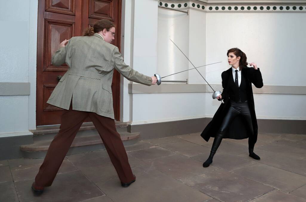 EN GARDE: Sherlock Holmes (Iain Wright) and Moriarty (Lauren Walker) engage in a fencing duel. Pictures: Kieren Tilly