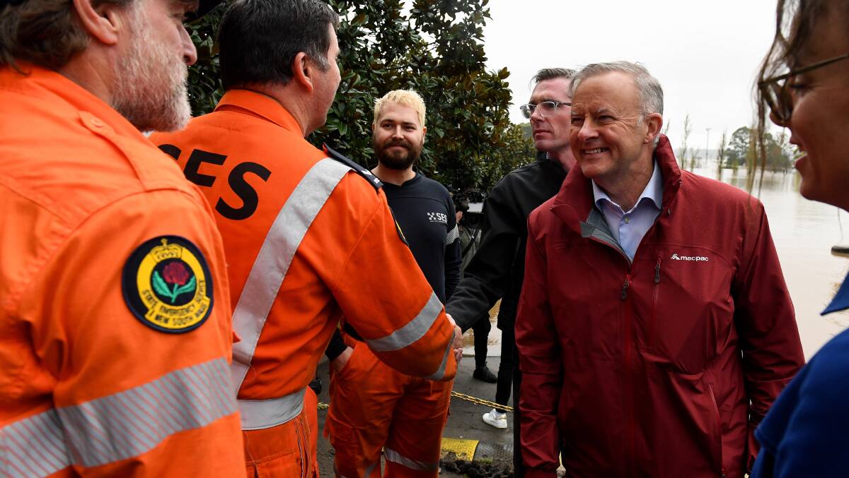 NSW Premier Dominic Perrottet and Prime Minister Anthony Albanese meet with SES volunteers in Richmond on Wednesday. Picture: AAP