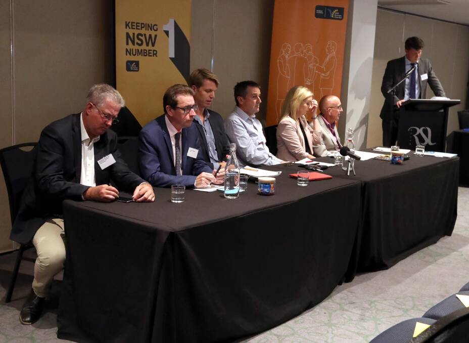 THE CANDIDATES: Shooters, Farmers and Fishers Sebastian McDonagh, Independent Dr Joe McGirr, Labor Dan Hayes, Australian Conservatives Colin Taggart, Nationals Mackenna Powell and Greens Ray Goodlass with NSW Business Chamber's Chris Lamont at lectern. Picture: Les Smith
