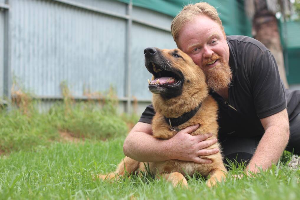 Anthony Fretwell with his seven-year-old German shepherd Rex. Picture: Emma Horn