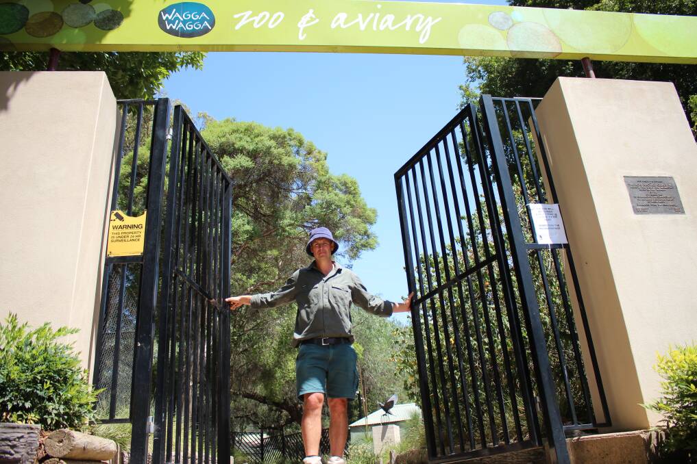 Henry Pavitt closes the gates of the zoo at the Botanic Gardens when the heat reaches above 38-degrees. Picture: Emma Horn