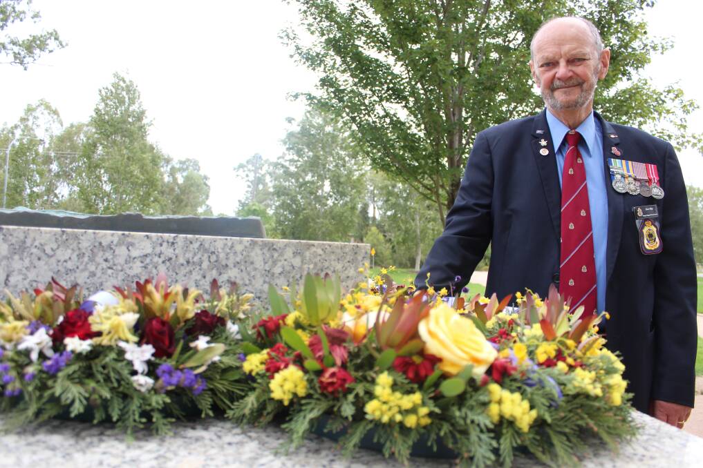 IN REMEMBRANCE: Ken May of the Wagga RSL sub-branch, commemorates the fall of Singapore at the Victory Memorial Gardens. Picture: Emma Horn