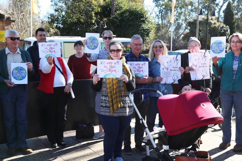 ACTION: Protesters flooded the civic precinct on Friday, calling on Wagga City Council to enforce a climate emergency during next week's council meeting. Picture: Emma Hillier