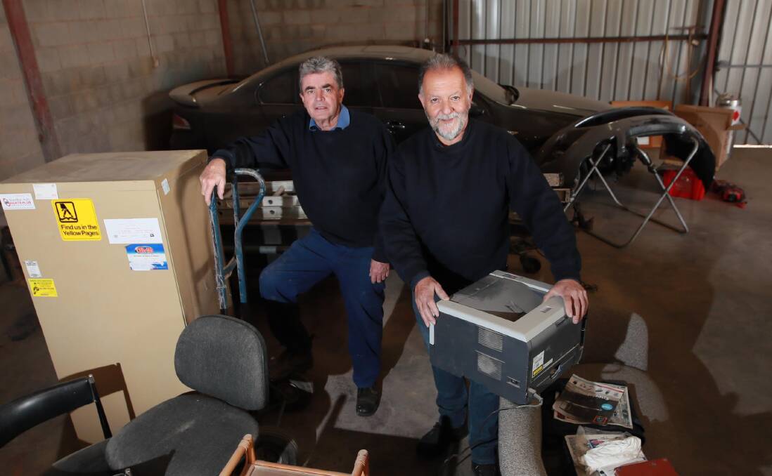 DECADES OF FRIENDSHIP: Mark Brown and Elio Giunco have announced their retirement after building their business together for the past 40 years. Picture: Les Smith