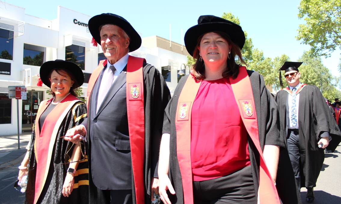 ON PARADE: Charles Sturt University academic council members Saranne Cooke Philip Clark and Lisa Schofield during the procession down Baylis Street.