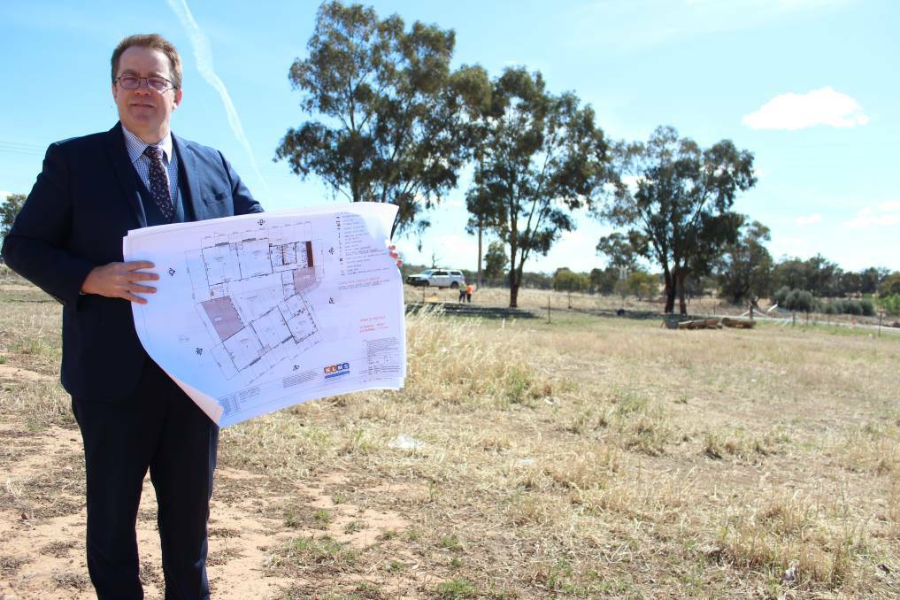TRAC principal Paul Humble with the master plans for the junior school which will be opening on site in 2021. Picture: FILE