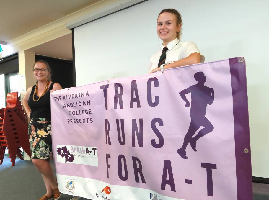 FUNDS RAISED: TRAC teacher Jane Lister with 17-year-old Holly Wilson were instrumental in organising the colour runs. Picture: Les Smith