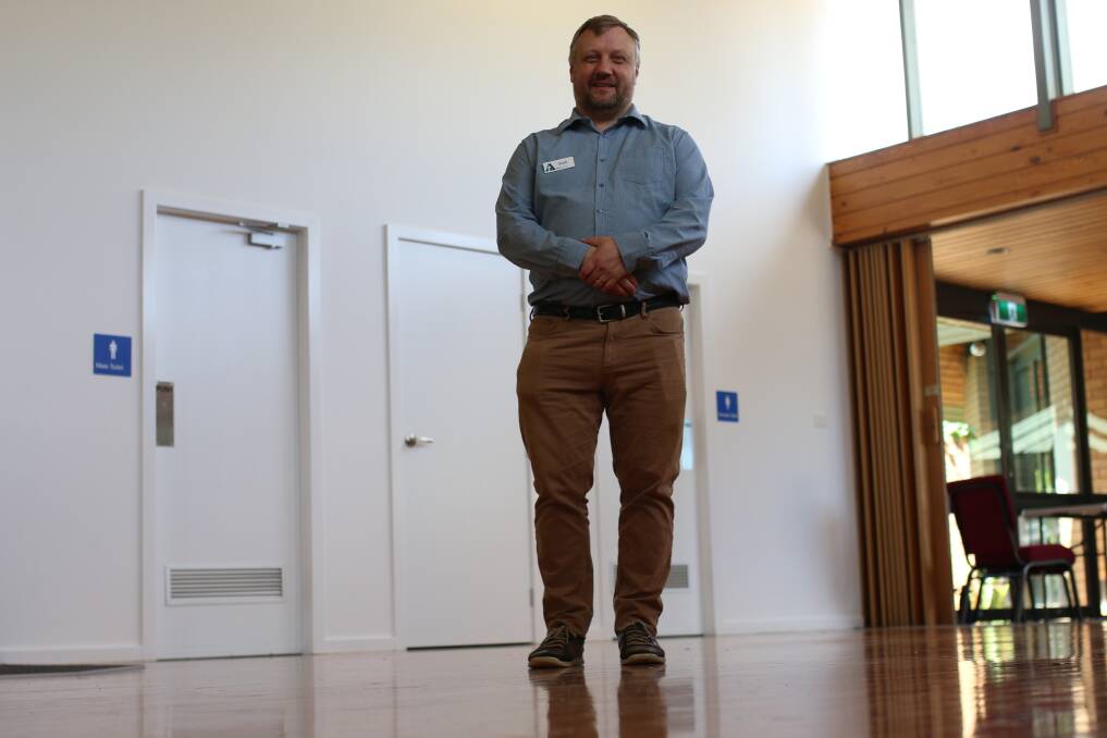 Scott Goode unveils the newly finished floors and amenities at St Paul's Anglican Church South Wagga. Picture: Emma Horn