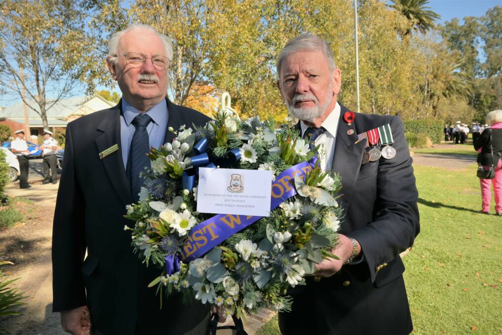COMMEMORATION: James Donohue was once an ordinary seaman radar plotter 2, and David Williams served as a warrant officer marine engineer onboard the HMAS Wagga. Picture: Kenji Sato