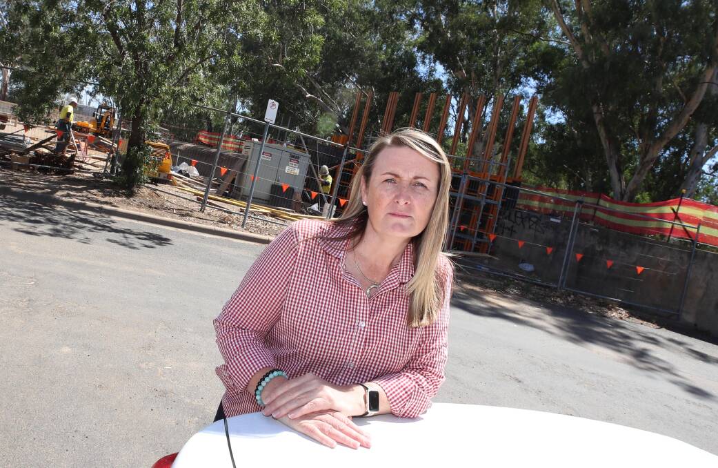 Deanna McNaughton outside Knights Meats & Deli. Levee bank construction has closed the carpark across the street, making it difficult for the butcher to turn a profit. Picture: Les Smith