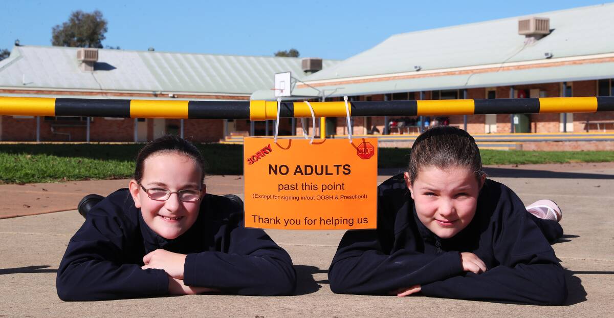 SAFETY ZONE: Wagga Christian College students Zoe Wilson, 12 and sister Zara, 10, return with some added restrictions. Picture: Emma Hillier