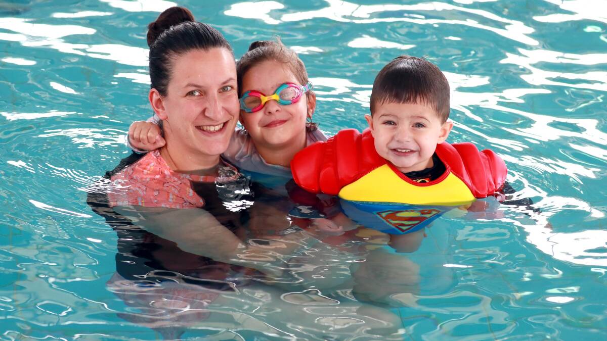 COOLING OFF: Elisa Kingsbury from Wagga with her children Logan, 2 and Gemma, 4 at the Oasis during a hot summer's day in January 2020. Picture: Les Smith