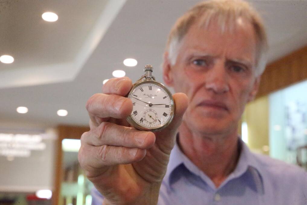 Robin Brown with the gold pocket watch he purchased accidentally for $5 at an auction in Darlington Point. Picture: Anthony Stipo