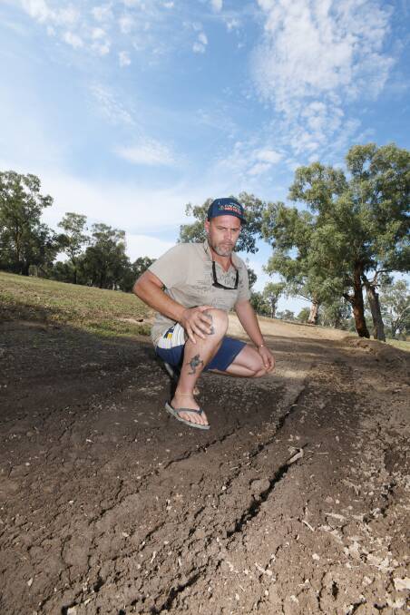 MAKING TRACKS: Nigel Curtis surveys the damage to the land.