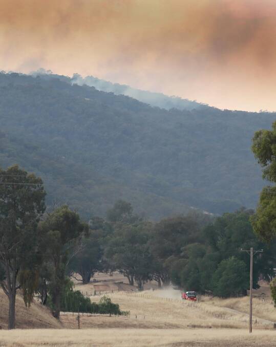 Junee RFS brigades dispatched to the Dunns Road fire via Stewarts Road following its outbreak south of Tarcutta on December 28, 2019. Picture: Les Smith