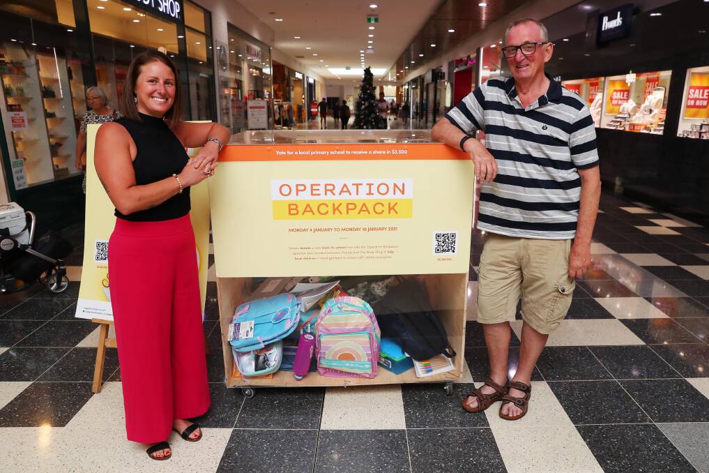 BACK TO SCHOOL: St Vincent de Paul's Operation Backpack co-ordinator Jacqueline Malcolm and president Peter Burgess with the first week's donations. Picture: Emma Hillier