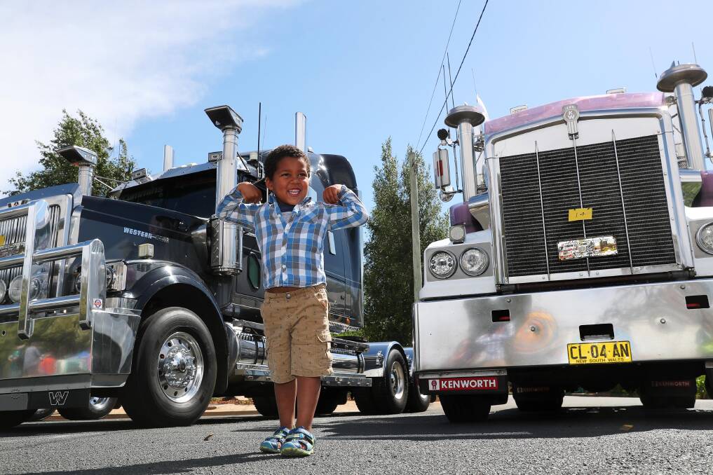 Agand Alew, 3 from Wagga gets up close and personal with some of the convoy trucks. Picture: Emma Hillier