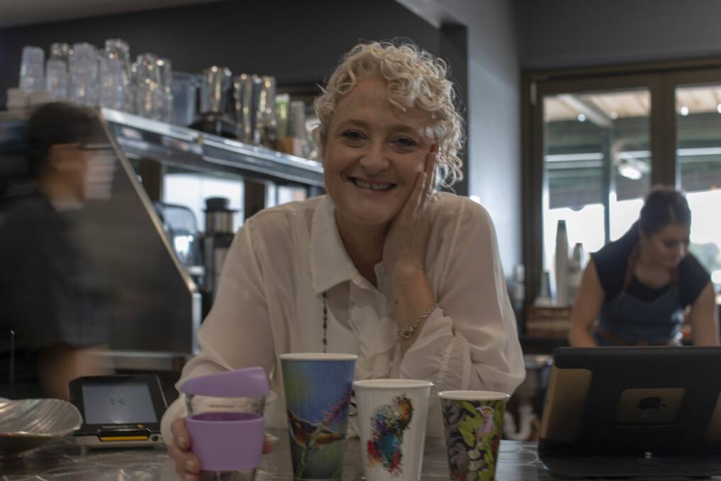KEEP THE CUP: Roslyn Mitchell, owner of Mock Orange cafe, would like to see non-biodegradable coffee cups become a thing of the past but does not think cigarette-style warning labels will help the cause. Picture: Emma Horn