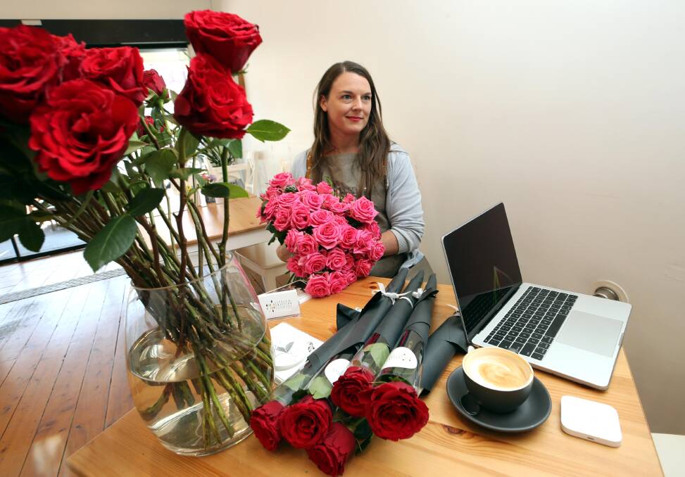 Sophie Kurylowicz partnered with Harans Pattiserie to sell her home-grown flowers on Valentine's Day. She believes the changes to import laws will promote a better fresh flower industry. Picture: Les Smith
