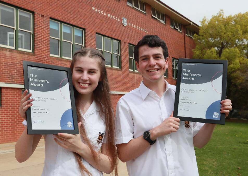 Mackenzie Purtill-Wright and Edward Prescott with their ministers awards for excellence in student achievement. Picture: Les Smith