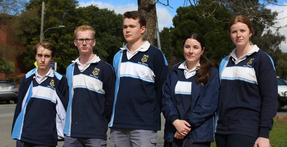 COPING WITH RESTRICTIONS: Wagga High students Stewart McDonald, James Pitstock, Lachlan Wordsworth, Ruby Condon and Lily Moon are grappling with the changes that might pull the pin on their graduation and formal.