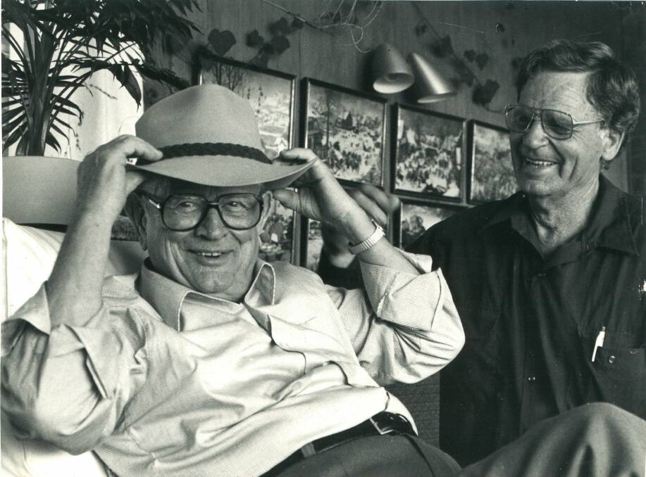 ENEMY TO FRIEND: Wolfgang Stiebler (left), the former captain of the U-boat sunk by Dudley Marrows (right) tries on an Australia akubra while visiting Mildura. Picture: supplied
