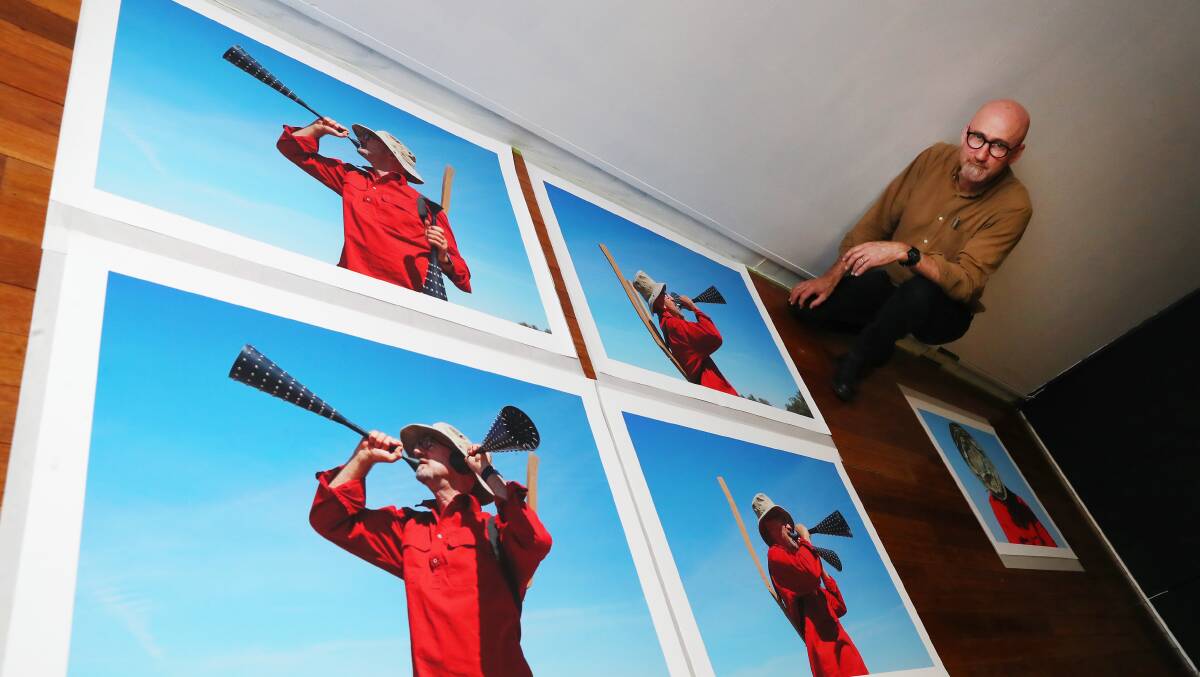 A FARM IN SPACE: Ian Tully mounts his photographs ahead of the Mars Project exhibition at Wagga Art Gallery. Picture: Emma Hillier