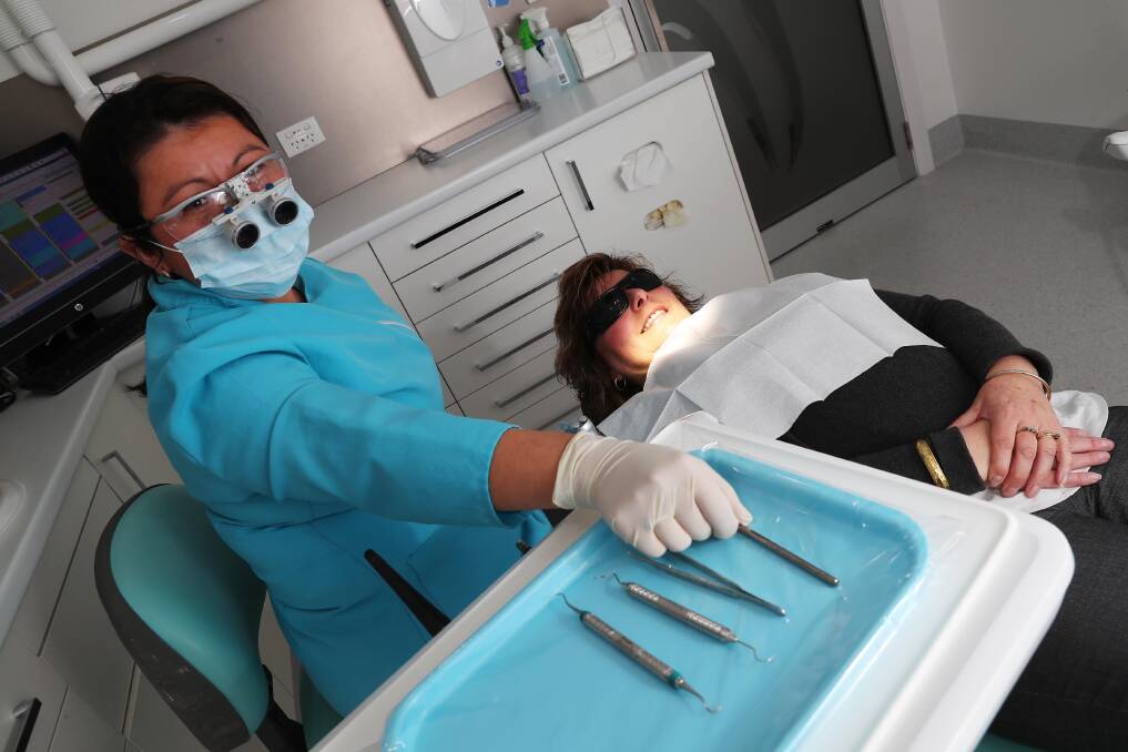 Dental hygienist Glenda Ramirez with patient Jenny Luff. Picture: Emma Hillier 