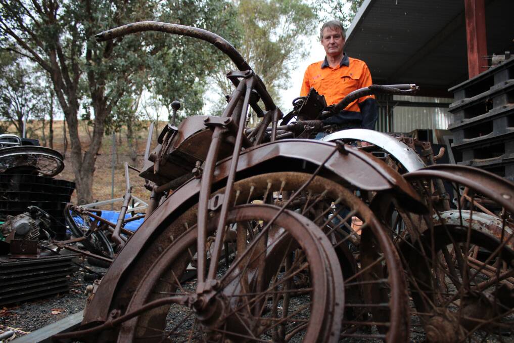 TREASURED TRASH: Geoffrey Pym with the vintage motorbikes found at Gregadoo Waste Management Facility. Picture: Emma Horn
