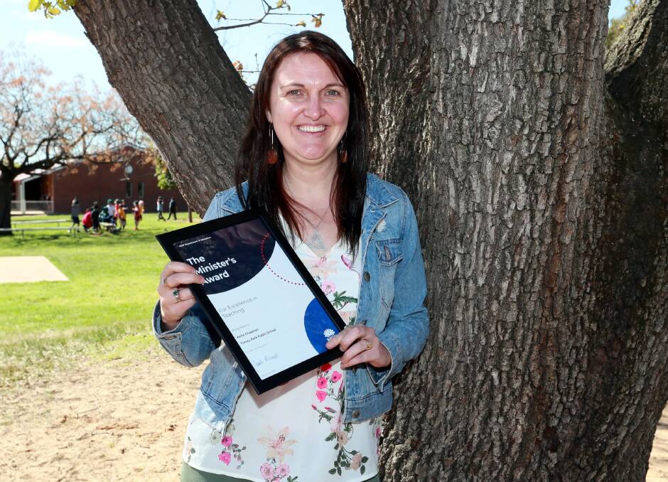 Alice Chapman with her excellence in teaching award. Picture: Les Smith