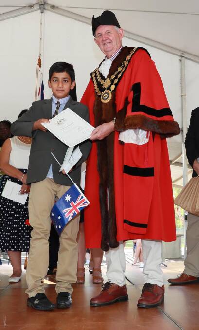 Hammad Kamran with mayor Greg Conkey upon receiving his certificate of citizenship on Sunday morning. Picture: Les Smith