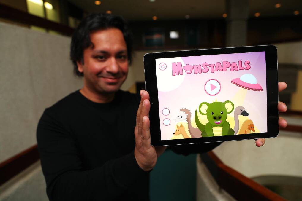Dev Mukherjee advocates for the education use of technology. Pictured with Anomaly Software's most recent creation 'Monstapals' which incorporates game elements for engagement as children learn about Australian animals. Picture: Emma Hillier