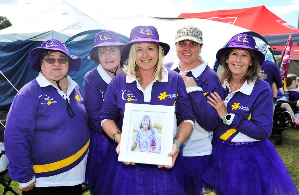 BELOVED: Amanda Bramich holds a photo of her mother, Lorraine Albert, surrounded by family members and friends Judy Brooker, Kerri Coleman, Linda Jeffries and Janelle Jeffries. Picture: Chelsea Sutton