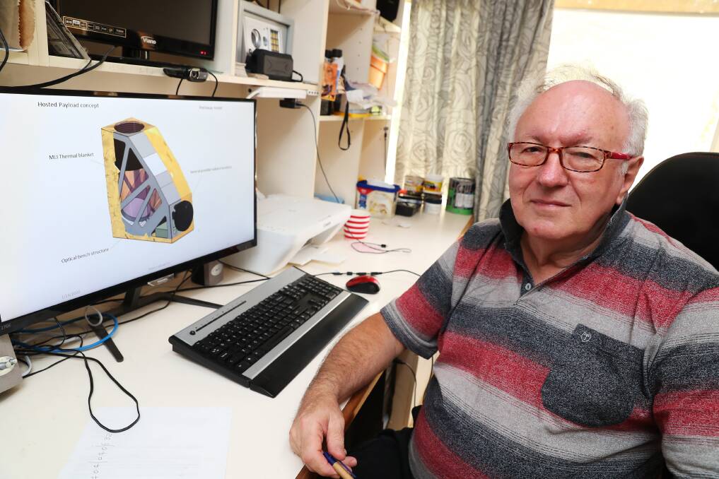 SPACE RACE: Dr Graeme White in his home office with models of the FUEGO bushfire detection hardware. Picture: Emma Hillier