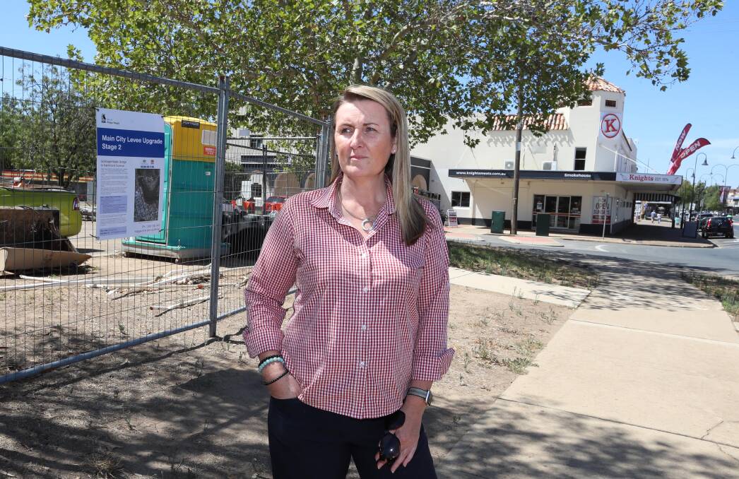 PARKING PROBLEM: Deanna McNaughton surveys the levee bank construction that has taken over the car park across the street from Knights Meats & Deli. Picture: Les Smith