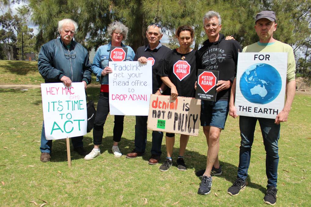 TOGETHER IN PROTEST: Wagga's Stop Adani members Bob Montgomery, Sharon Pope, Neil Harris, Leanne Schulz, Peter Lonsdale and Benjamin Roberts. Picture: Emma Horn
