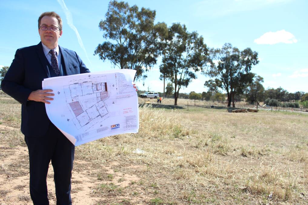 GRAND PLANS: The Riverina Anglican College principal Paul Humble holds the blueprints for the college's new primary school. Picture: Emma Horn