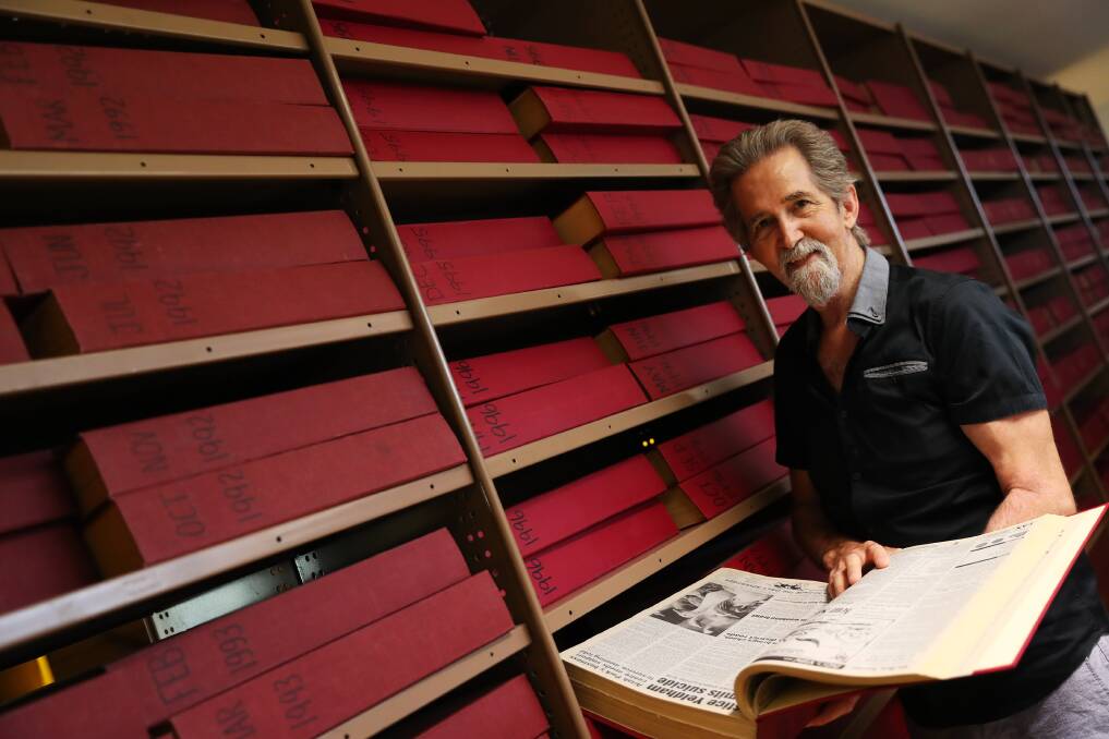 PAST TO PRESENT: Historian Geoff Burch glimpses into the city's past at the Charles Sturt University archives. Picture: Emma Hillier