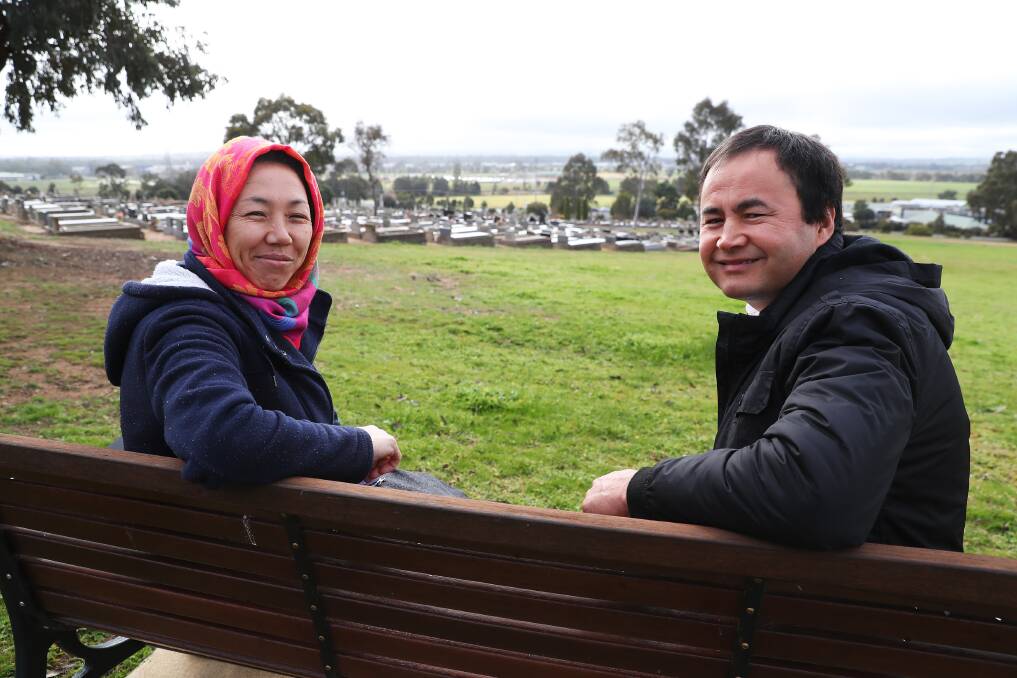 PERFECT PLOTS: Hakimah Rihimi and Reza Zafari survey the site inside the Monumental Cemetery that is now designated for Hazaras burials. Picture: Emma Hillier