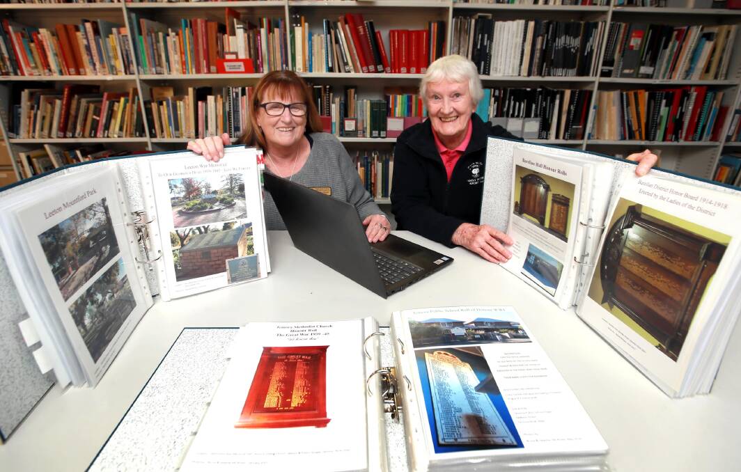WRITTEN RECORDS: Historic society volunteers Leanne Diessel and Jan Hurcum has spent years creating a digital database of war heroes. Picture: Les Smith
