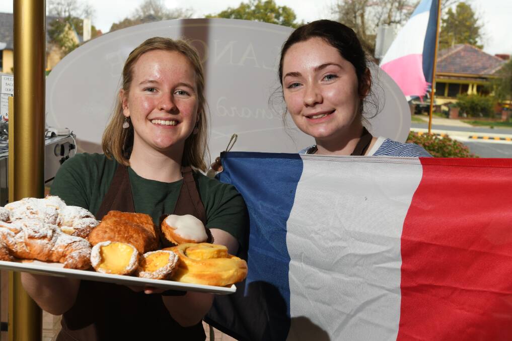 PASTRY PERFECTION: Lily Hamilton, 17, and Isabel Cox, 16, at the Artisan Bakery's Bastille Day celebration.