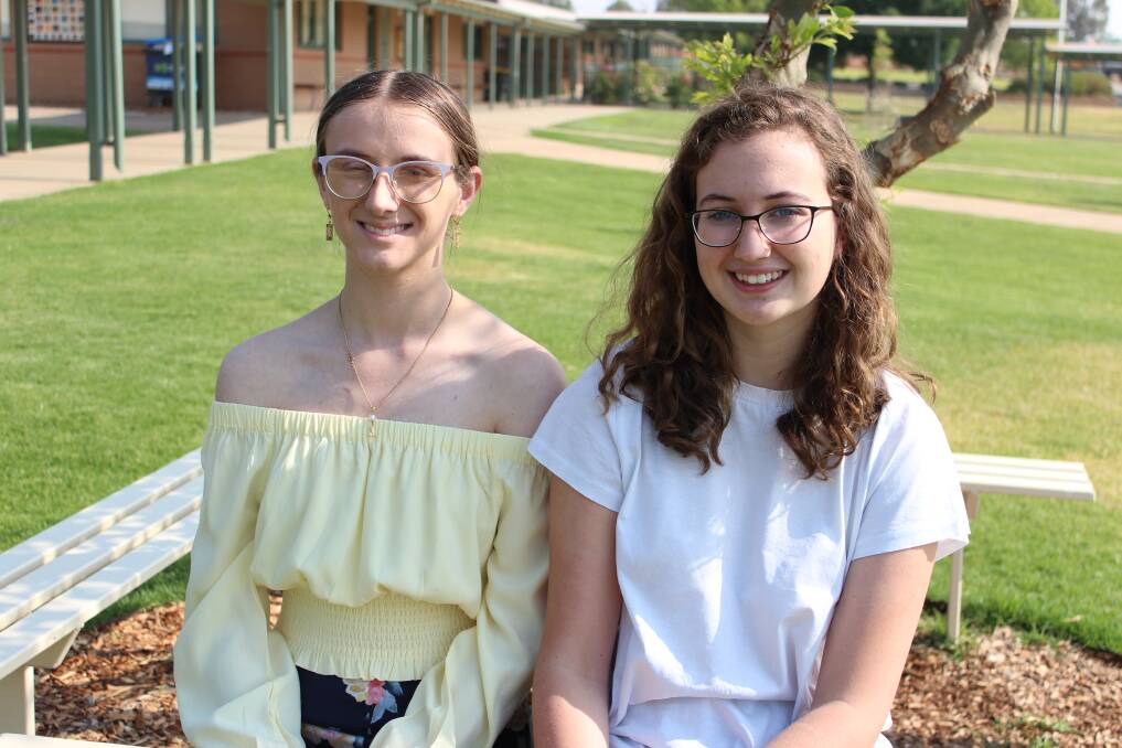 GETTING IN EARLY: Johanna Evans and Rosalie Lambert, both 17, have received early offers to university, but the anxiety is mounting to see whether they will make the grade to accept the offer. Picture: Emma Horn
