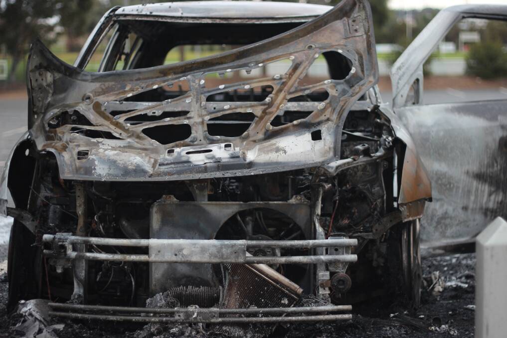 BURNT BONNET: Remains of the Suzuki near the entrance to the Jubilee Park hockey field. Picture: Emma Horn