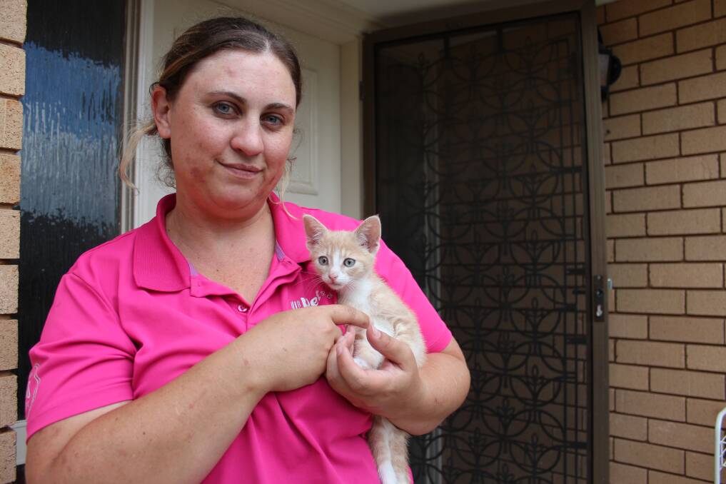 RESCUED: Renai Kneebone with seven-week-old Viserion, the cat she rescued when she witnessed it being tossed from the window of a moving vehicle on Inglewood Road last week. Picture: Emma Horn