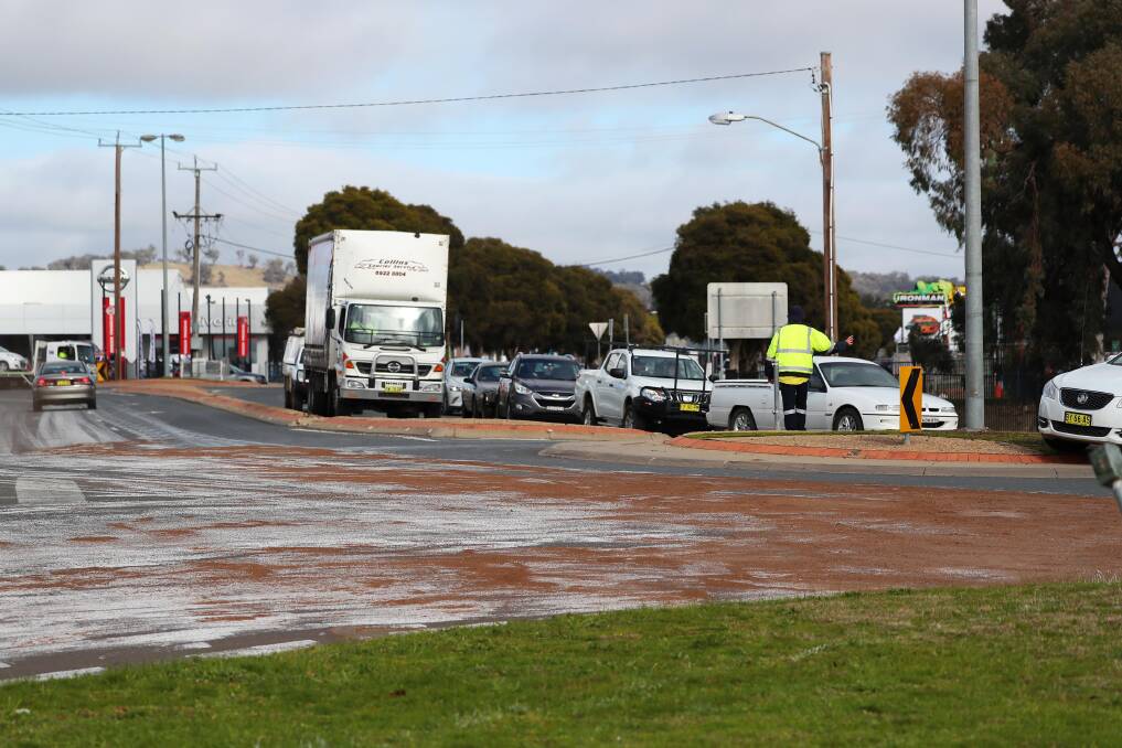 PAINTING SPILL: Dobney Avenue was closed to north traffic during clean up operations. Picture: Emma Hillier