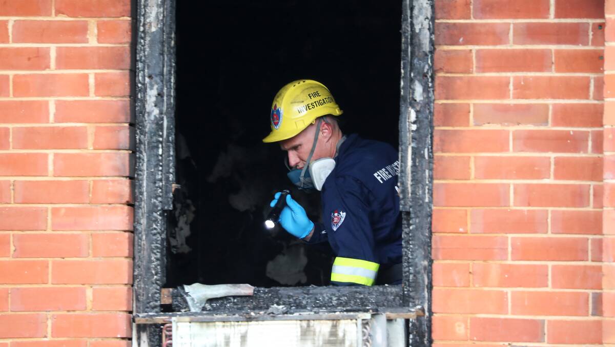 FIRE PROBE: Investigators work to determine the cause of a fire that tore through a house on South Parade on Friday night. Picture: Emma Hillier