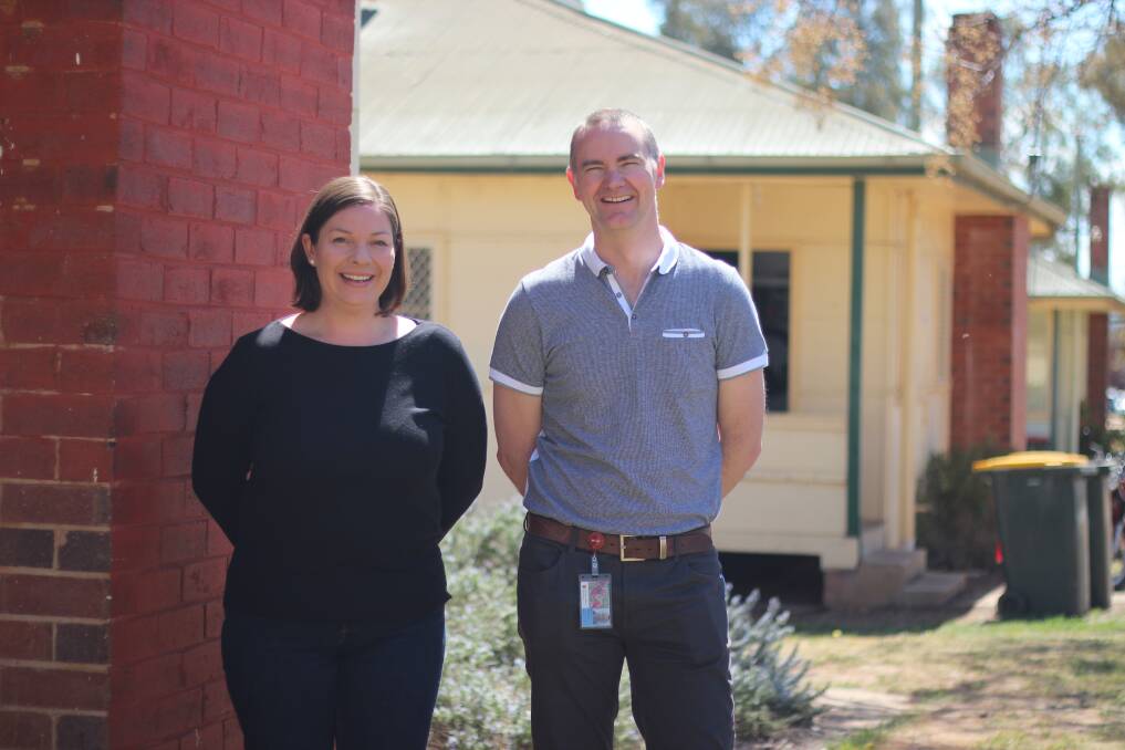 ERA END: Project manager Emma McCormick and university archives manager Wayne Doubleday in front of the houses slated for demolition. Picture: Emma Horn