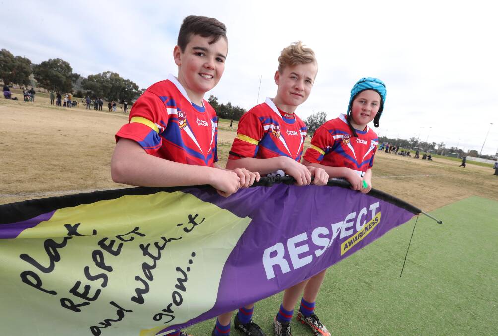 Wagga Kangaroos league under 13's Angus O'Brien, Noah Killeep, and Lachlan Press wearing yellow armbands in preparation for Respect Sports Weekend. Picture: Les Smith