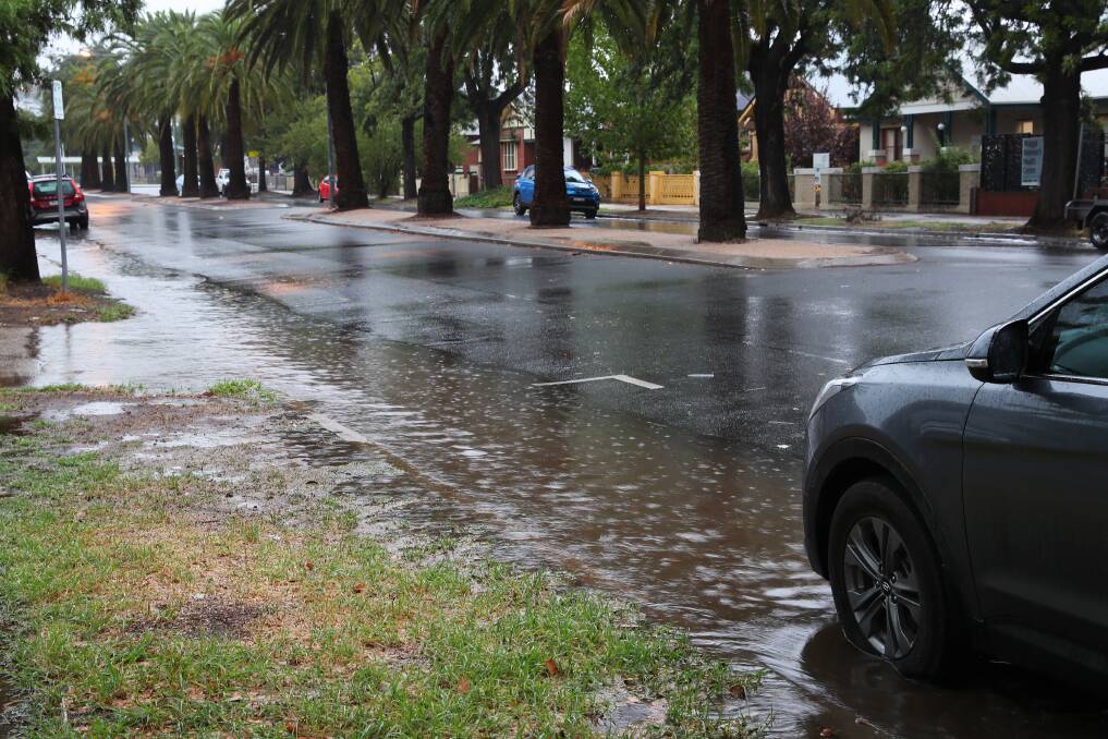 Several significant weather events helped the city exceed its monthly precipitation average for March. Flash flooding occurred in the CBD during the storm on March 29. Picture: Emma Hillier