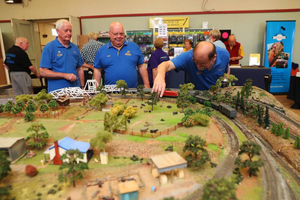 MODEL MECHANICS: Terry Smith, Malcolm Irving and Andrew Lund of the Canberra Model Railway Club. Picture: Emma Hillier
